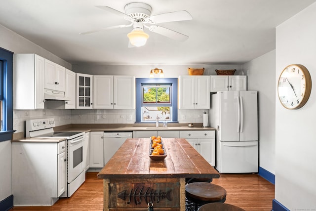 5 Maple Corners Rd, Ledyard, CT 06335 - kitchen featuring white appliances, light wood-style floors, backsplash, white cabinetry, and glass insert cabinets