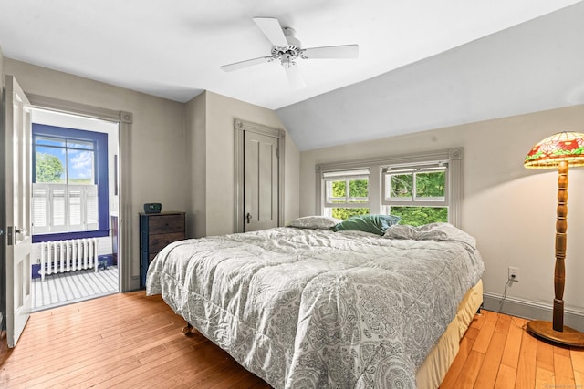 5 Maple Corners Rd, Ledyard, CT 06335 - bedroom with radiator, multiple windows, wood-type flooring, baseboards, and lofted ceiling