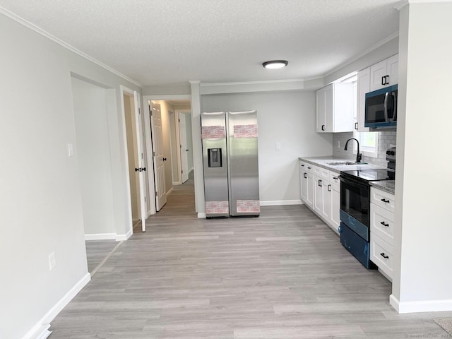40 Cherry St, Hartford, CT 06106 - kitchen with stainless steel refrigerator with ice dispenser, black electric range, white cabinetry, light wood finished floors, and crown molding