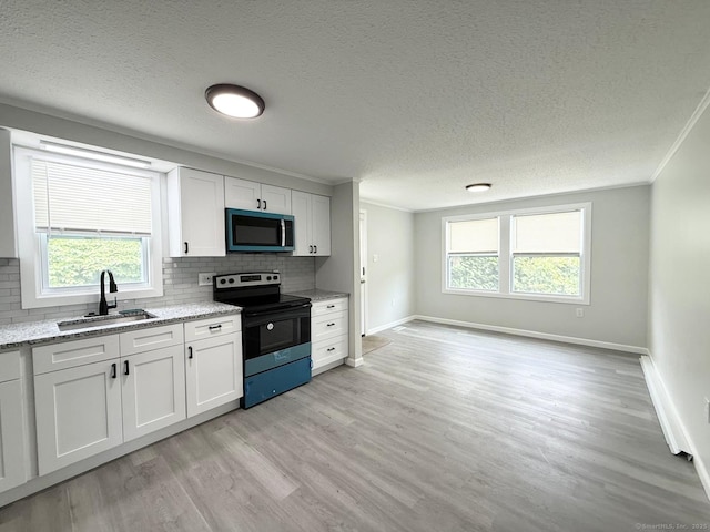 40 Cherry St, Hartford, CT 06106 - kitchen with black / electric stove, crown molding, light wood-style floors, tasteful backsplash, and a textured ceiling