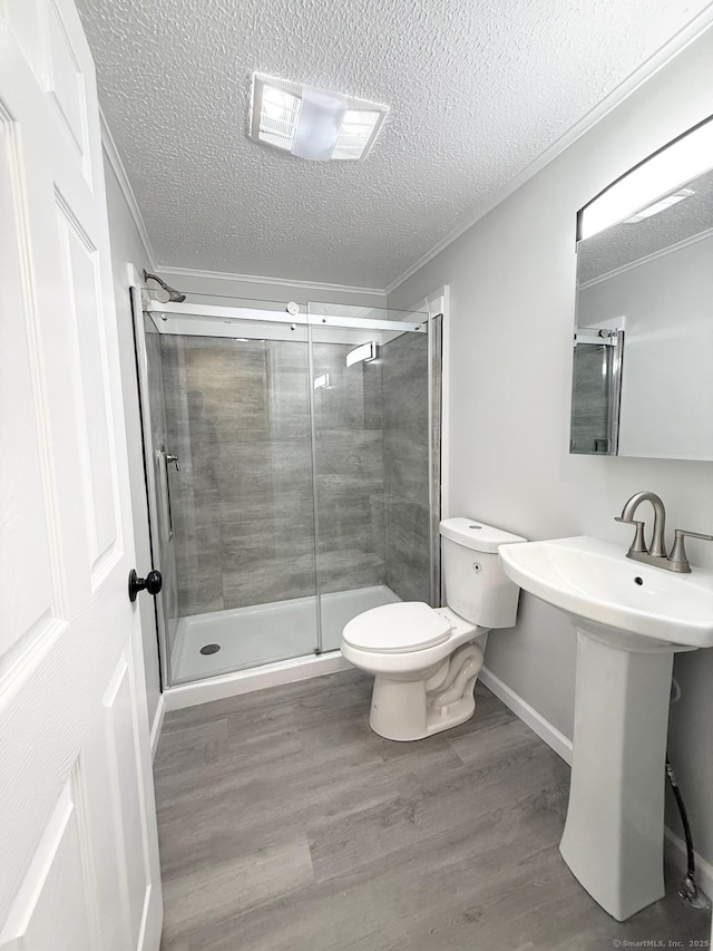 40 Cherry St, Hartford, CT 06106 - full bathroom with a textured ceiling, crown molding, wood finished floors, and a shower stall