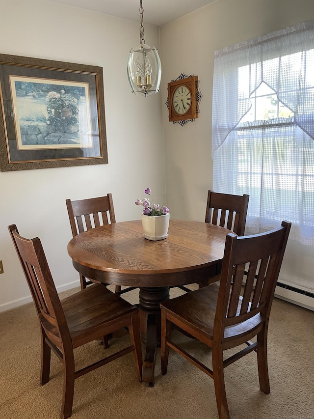 268 Hartford Tpke Apt A2, Tolland, CT 06084 - dining room featuring light colored carpet, a chandelier, and a baseboard heating unit