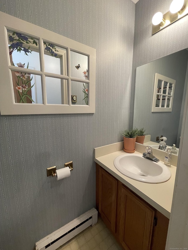 268 Hartford Tpke Apt A2, Tolland, CT 06084 - bathroom featuring a baseboard radiator, vanity, and wallpapered walls