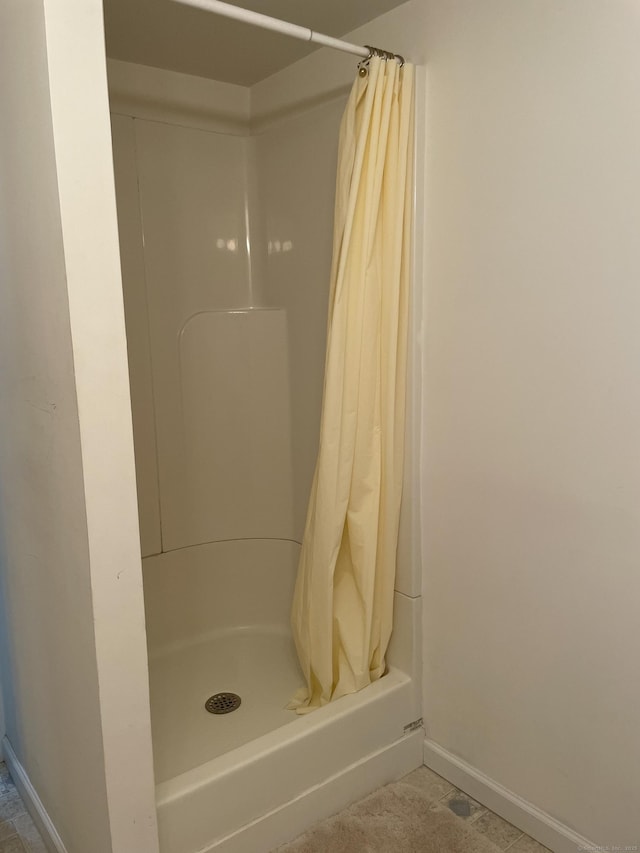 268 Hartford Tpke Apt A2, Tolland, CT 06084 - bathroom with curtained shower and baseboards