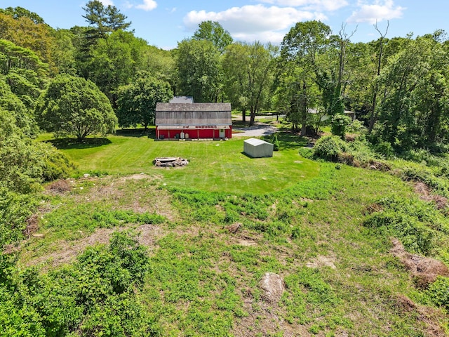 157 Mile Creek Rd, Old Lyme, CT 06371 - view of green lawn featuring an outdoor structure, a forest view, and a barn