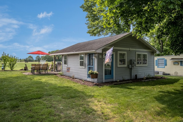 45 E St, Madison, CT 06443 - view of property exterior with a yard and roof with shingles