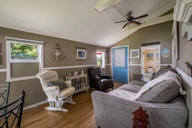 45 E St, Madison, CT 06443 - living room with wainscoting, vaulted ceiling, a ceiling fan, wood finished floors, and wooden walls