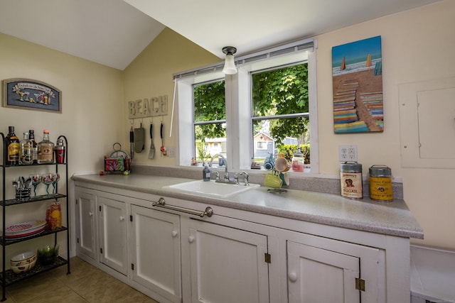 45 E St, Madison, CT 06443 - kitchen featuring a sink, light tile patterned flooring, light countertops, lofted ceiling, and electric panel