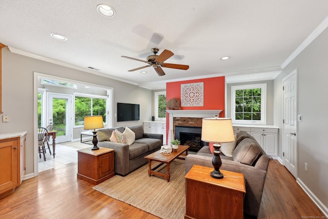 20 Cherry Ln, Madison, CT 06443 - living area with ornamental molding, light wood-style floors, a ceiling fan, a brick fireplace, and recessed lighting