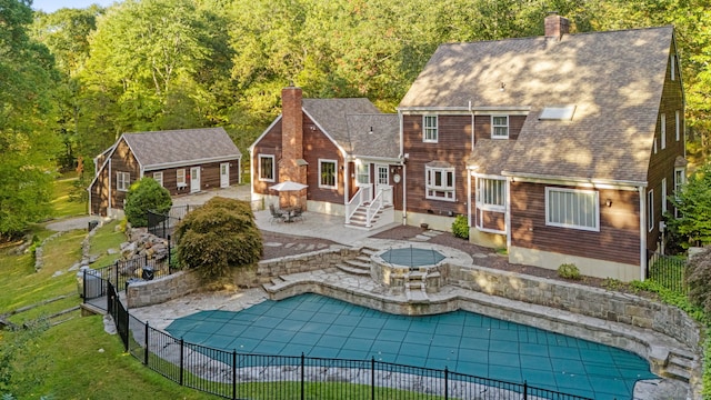3 Dan Beard Ln, Redding, CT 06896 - rear view of house with a chimney, a patio, and a shingled roof