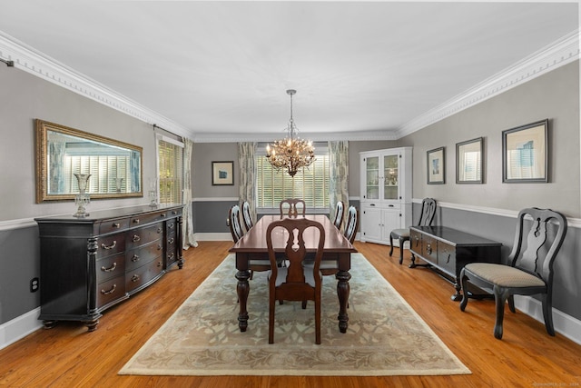 3 Dan Beard Ln, Redding, CT 06896 - dining area featuring a chandelier, light wood finished floors, ornamental molding, and baseboards