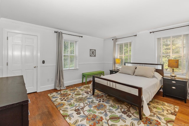 3 Dan Beard Ln, Redding, CT 06896 - bedroom featuring crown molding, wood finished floors, multiple windows, and baseboards