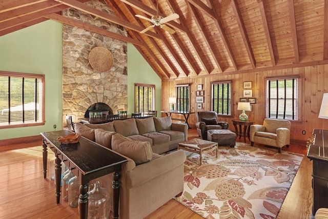 3 Dan Beard Ln, Redding, CT 06896 - living room with wood finished floors, a fireplace, high vaulted ceiling, a ceiling fan, and baseboards