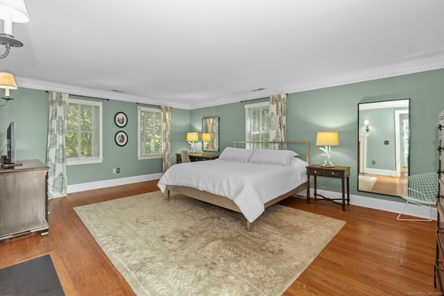 3 Dan Beard Ln, Redding, CT 06896 - bedroom with ornamental molding, baseboards, multiple windows, and wood finished floors