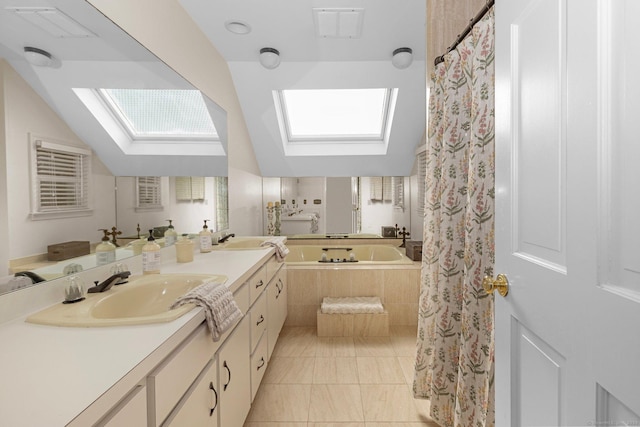 3 Dan Beard Ln, Redding, CT 06896 - bathroom featuring a skylight, vanity, vaulted ceiling, tiled bath, and tile patterned floors