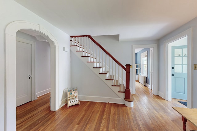 1 Yale Ave, Middlebury, CT 06762 - entrance foyer with wood finished floors, baseboards, arched walkways, and stairway
