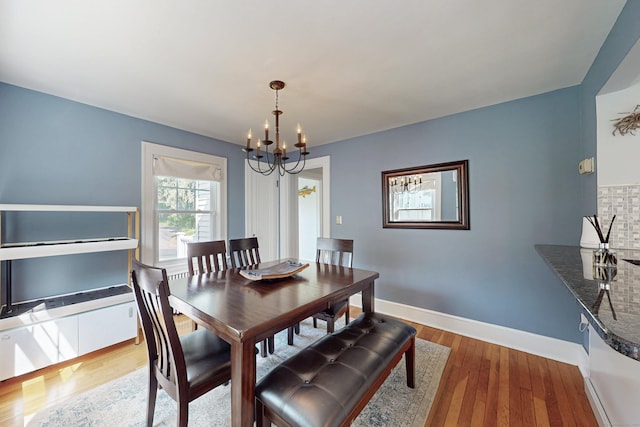 1 Yale Ave, Middlebury, CT 06762 - dining space with a chandelier, wood finished floors, and baseboards