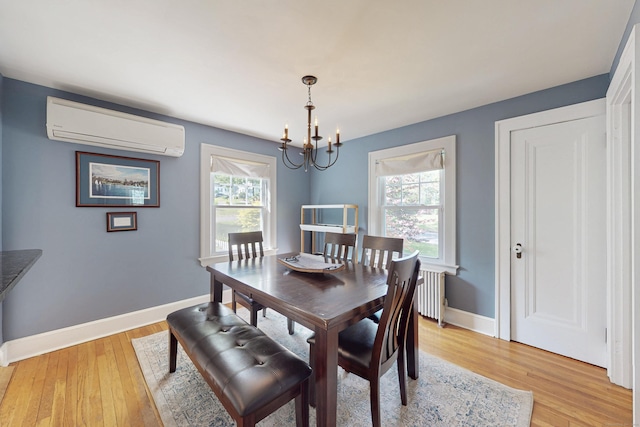 1 Yale Ave, Middlebury, CT 06762 - dining space with a wall mounted AC, a chandelier, light wood-style flooring, and baseboards
