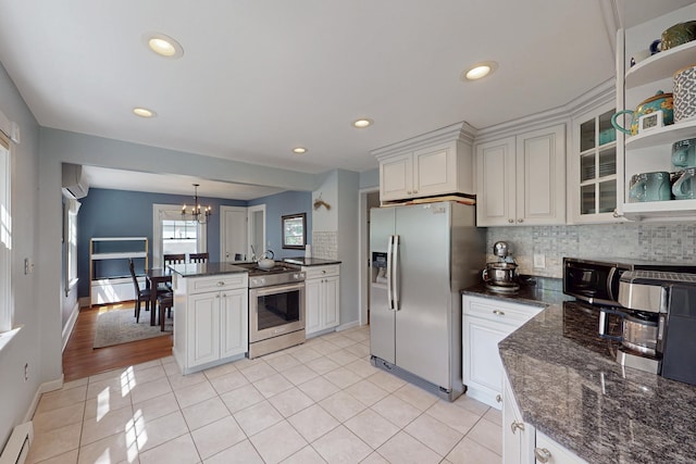 1 Yale Ave, Middlebury, CT 06762 - kitchen featuring stainless steel appliances, light tile patterned flooring, a chandelier, backsplash, and glass insert cabinets