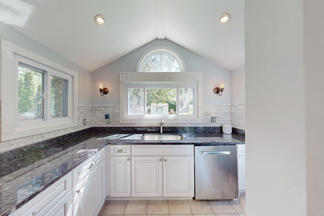 1 Yale Ave, Middlebury, CT 06762 - kitchen featuring stainless steel dishwasher, a sink, vaulted ceiling, light tile patterned floors, and dark stone counters