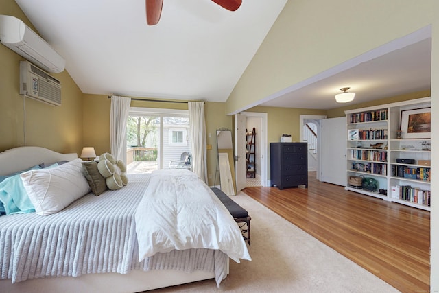 1 Yale Ave, Middlebury, CT 06762 - bedroom with an AC wall unit, wood finished floors, a wall mounted air conditioner, lofted ceiling, and access to outside