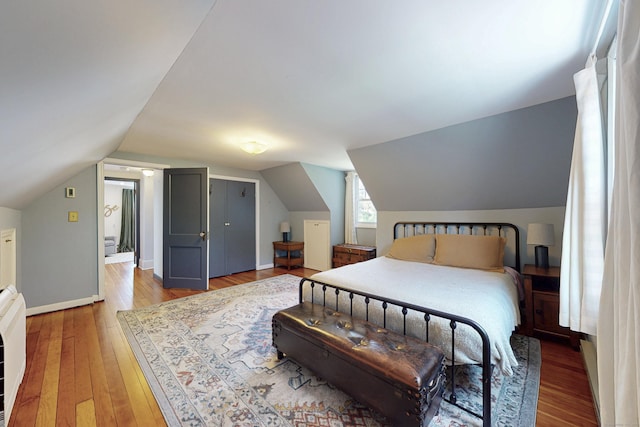 1 Yale Ave, Middlebury, CT 06762 - bedroom with light wood-type flooring, lofted ceiling, and baseboards