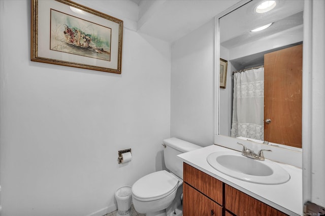 bathroom with vanity and toilet