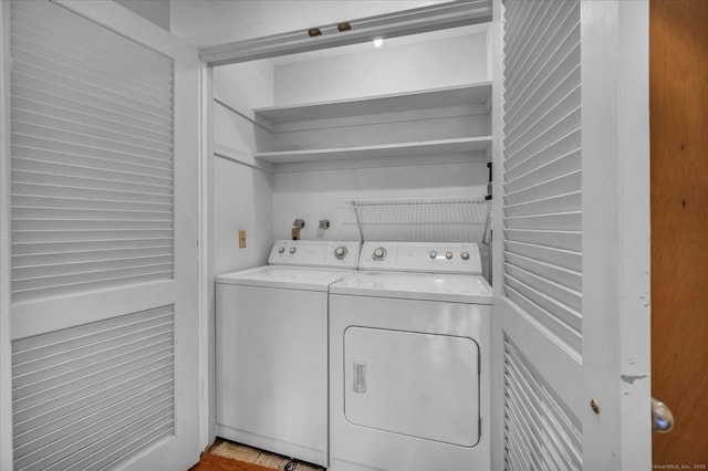 laundry room with washing machine and clothes dryer
