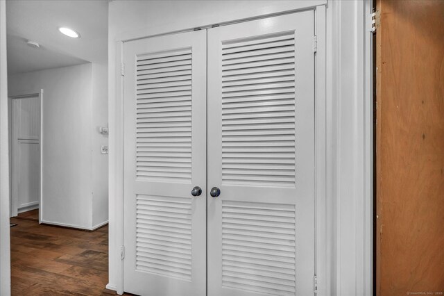 detailed view of wood finished floors, recessed lighting, and a smoke detector