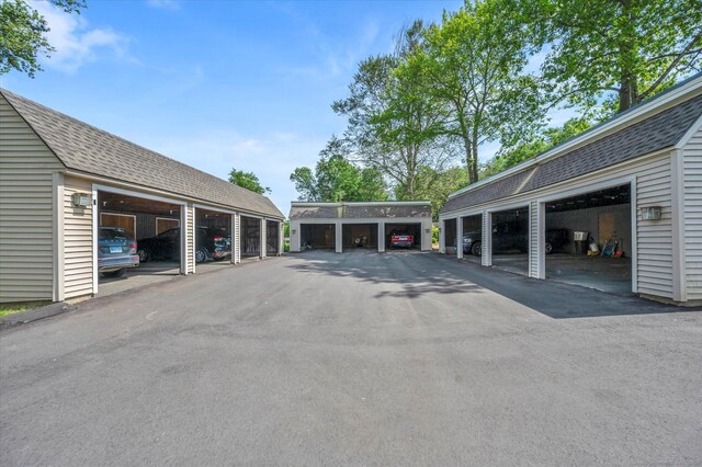 view of parking featuring community garages