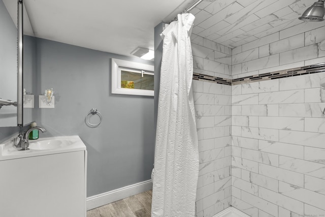 100 Boston Ter, Bridgeport, CT 06610 - full bathroom featuring tiled shower, vanity, wood finished floors, and baseboards