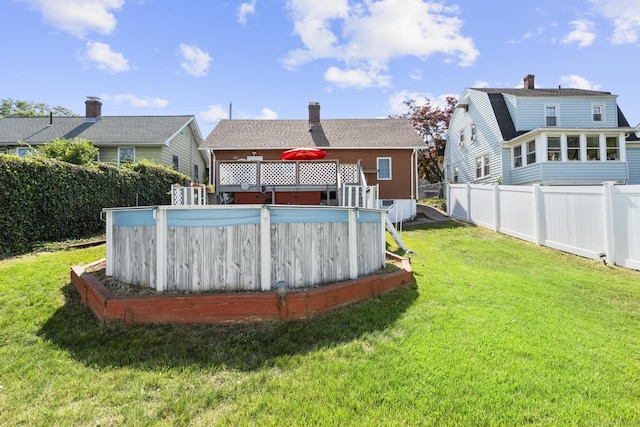 100 Boston Ter, Bridgeport, CT 06610 - back of house with a chimney and a wooden deck