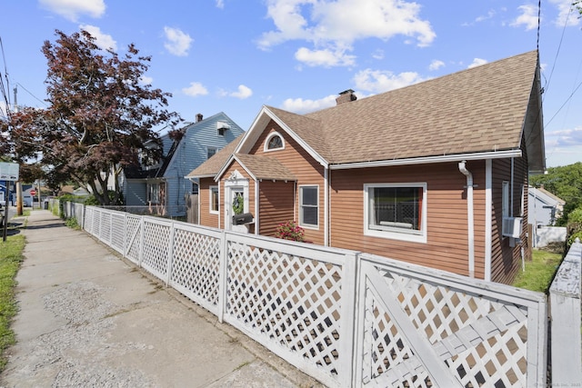 100 Boston Ter, Bridgeport, CT 06610 - view of front facade with roof with shingles and a chimney
