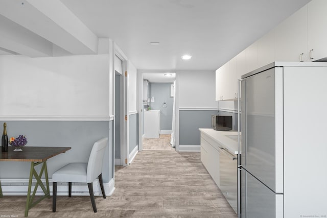 100 Boston Ter, Bridgeport, CT 06610 - kitchen with refrigerator, stainless steel dishwasher, light wood-style flooring, white cabinetry, and recessed lighting