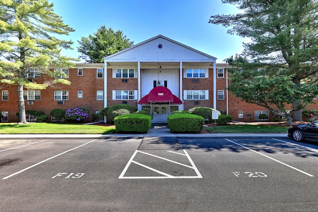 1120 New Haven Ave Apt 142, Milford, CT 06460 - view of property featuring uncovered parking