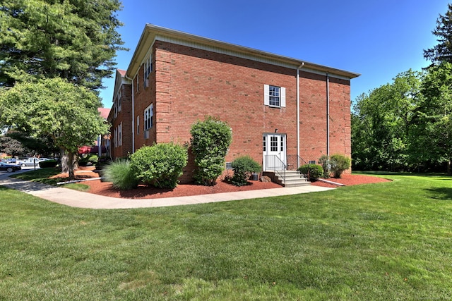 1120 New Haven Ave Apt 142, Milford, CT 06460 - back of house featuring a yard, entry steps, and brick siding