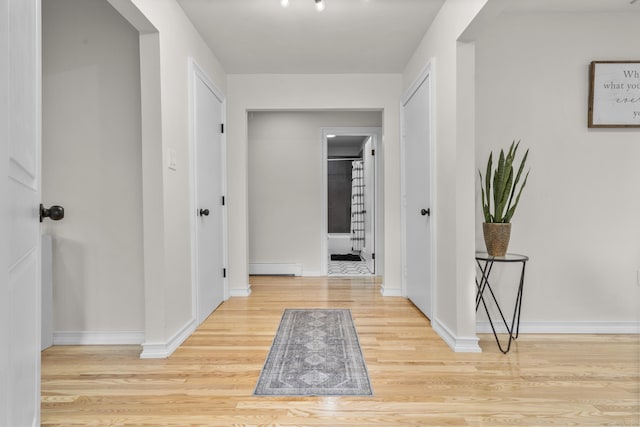 4 Wanzer Hill Rd, Sherman, CT 06784 - hallway featuring wood finished floors, a baseboard radiator, and baseboards