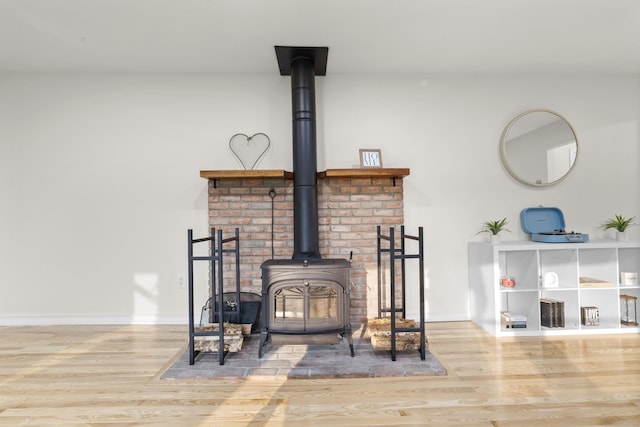 4 Wanzer Hill Rd, Sherman, CT 06784 - detailed view of wood finished floors, a wood stove, and baseboards
