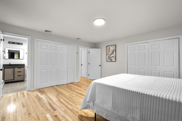 4 Wanzer Hill Rd, Sherman, CT 06784 - bedroom with light wood-style floors and two closets