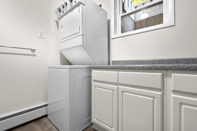 4 Wanzer Hill Rd, Sherman, CT 06784 - laundry room featuring baseboard heating, stacked washer and clothes dryer, cabinet space, and dark wood finished floors