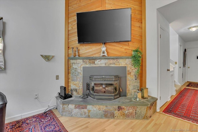 424 Trailsend Dr Unit 424, Torrington, CT 06790 - detailed view of a wood stove and wood finished floors