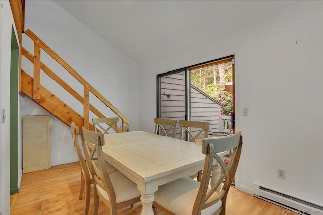 424 Trailsend Dr Unit 424, Torrington, CT 06790 - dining room featuring a baseboard radiator, light wood-style floors, and stairs