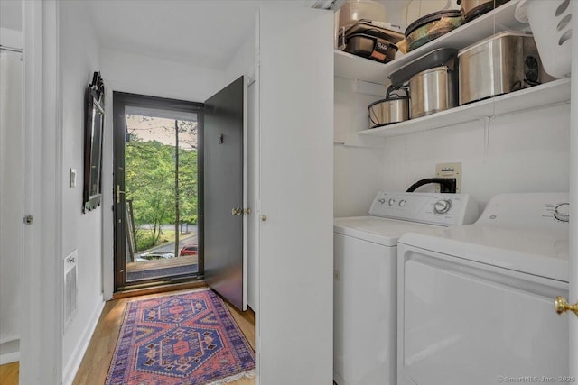424 Trailsend Dr Unit 424, Torrington, CT 06790 - washroom with washer and dryer and light wood-style floors