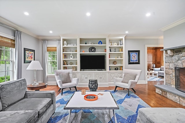 6 Coachlamp Ln, Greenwich, CT 06830 - living room featuring crown molding, a stone fireplace, recessed lighting, wood finished floors, and baseboards