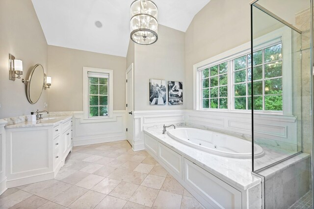 6 Coachlamp Ln, Greenwich, CT 06830 - full bathroom with vaulted ceiling, vanity, a tub with jets, plenty of natural light, and a chandelier