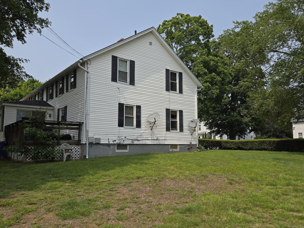 1 7th St, Plainfield, CT 06374 - view of side of home with a yard and a deck