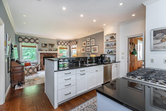 78 Garnet Rd, Roxbury, CT 06783 - kitchen with a peninsula, dishwasher, dark countertops, a sink, and ornamental molding