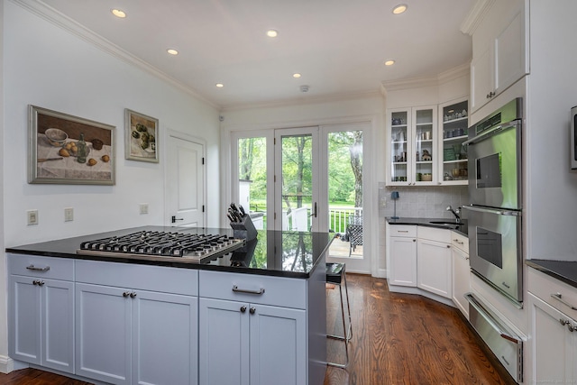 78 Garnet Rd, Roxbury, CT 06783 - kitchen featuring a warming drawer, appliances with stainless steel finishes, dark countertops, recessed lighting, and ornamental molding