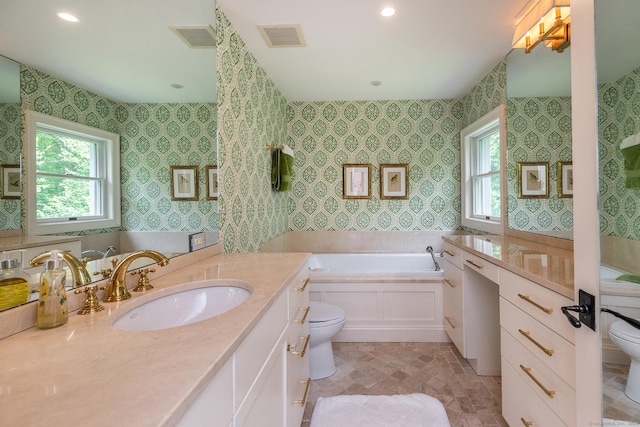 78 Garnet Rd, Roxbury, CT 06783 - full bathroom featuring toilet, a bath, stone finish flooring, vanity, and recessed lighting