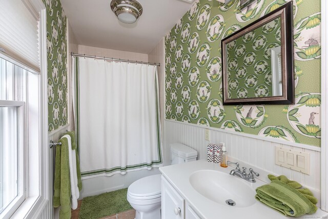 78 Garnet Rd, Roxbury, CT 06783 - full bathroom featuring wallpapered walls, toilet, vanity, a wainscoted wall, and tile patterned floors